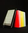 Row of books and electronic book reader