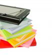 Stack of books and electronic book reader