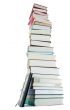 Tall stack of books and e-book reader