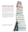 Tall stack of books and e-book reader