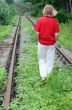 Walking Away Along Abandoned Railroad Track