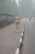 Woman walking in Heavy Smog