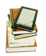 Stack of books and electronic book reader