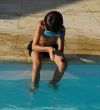 boy's diving in a swimming pool