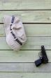 Hat and Pistol on Shabby Wooden Wall