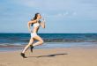 Young woman running alone on the beach