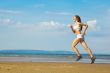 girl running alone on the beach