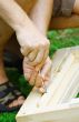 Man`s hands on a screwdriver