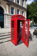 Old red telephone box in London