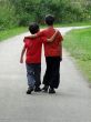 two children walking along a path