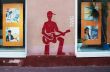 Drawing on a wall - the red guitarist