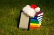 Electronic book reader with Santa`s hat