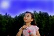 The little girl starts up soap bubbles