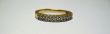Golden ring with a white stone isolated