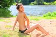 The young girl has a rest on a wood beach