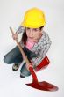 Female builder with a shovel