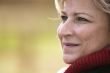 Mature woman looking away smiling