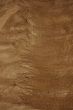 Texture of gold thread over stone.