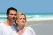 Couple stood together on a  beach