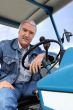 a man driving a tractor