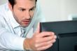 close-up of a man with computer