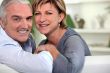 Smiling couple sitting on a sofa