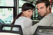 Couple riding the bus
