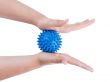 Woman`s hands with massage ball