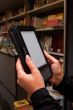 Woman`s hands holding electronic book reader