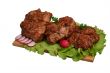Smoked chicken kebab on wooden board.