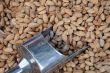 Unshelled Almonds and Metal Scoop