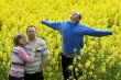 Three people in meadow
