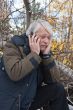 Mature middle-aged man in forest.