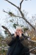 Mature middle-aged man in forest.