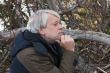 Middle-aged man in forest.