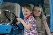 At the wheel.