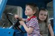 At the wheel.