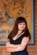 Beauty woman at retro poster with clock.
