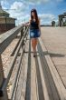 Beauty girl on the old-time bridge.