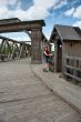 Beauty girl on old-time bridge.
