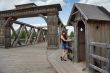 Beauty girl on old-time bridge.