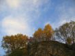 Golden autumn, blue sky and caucasus mountains