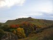 Golden autumn, blue sky and caucasus mountains
