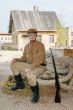 Retro style picture with soldier sitting on rope