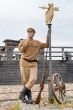Retro style picture with soldier at tram stop.