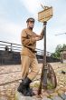 Retro style picture with soldier at tram stop.