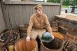 Retro style picture with soldier sitting on butt