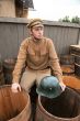 Retro style picture with soldier sitting on butt