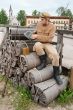 Retro style picture with soldier on bundles