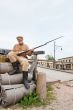 Retro style picture with soldier on the bundles